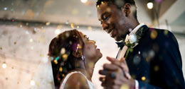 happy just wed couple with confetti